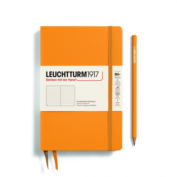 A rising sun notebook with an elastic to keep it closed.